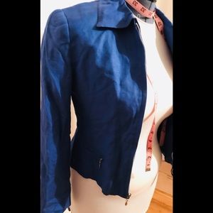 Cobalt blue jacket. Silver zip trim.